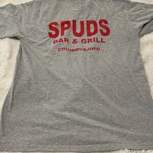 Gray T-Shirt with Red SPUDS Bar & Grill Print. Item # 11003
